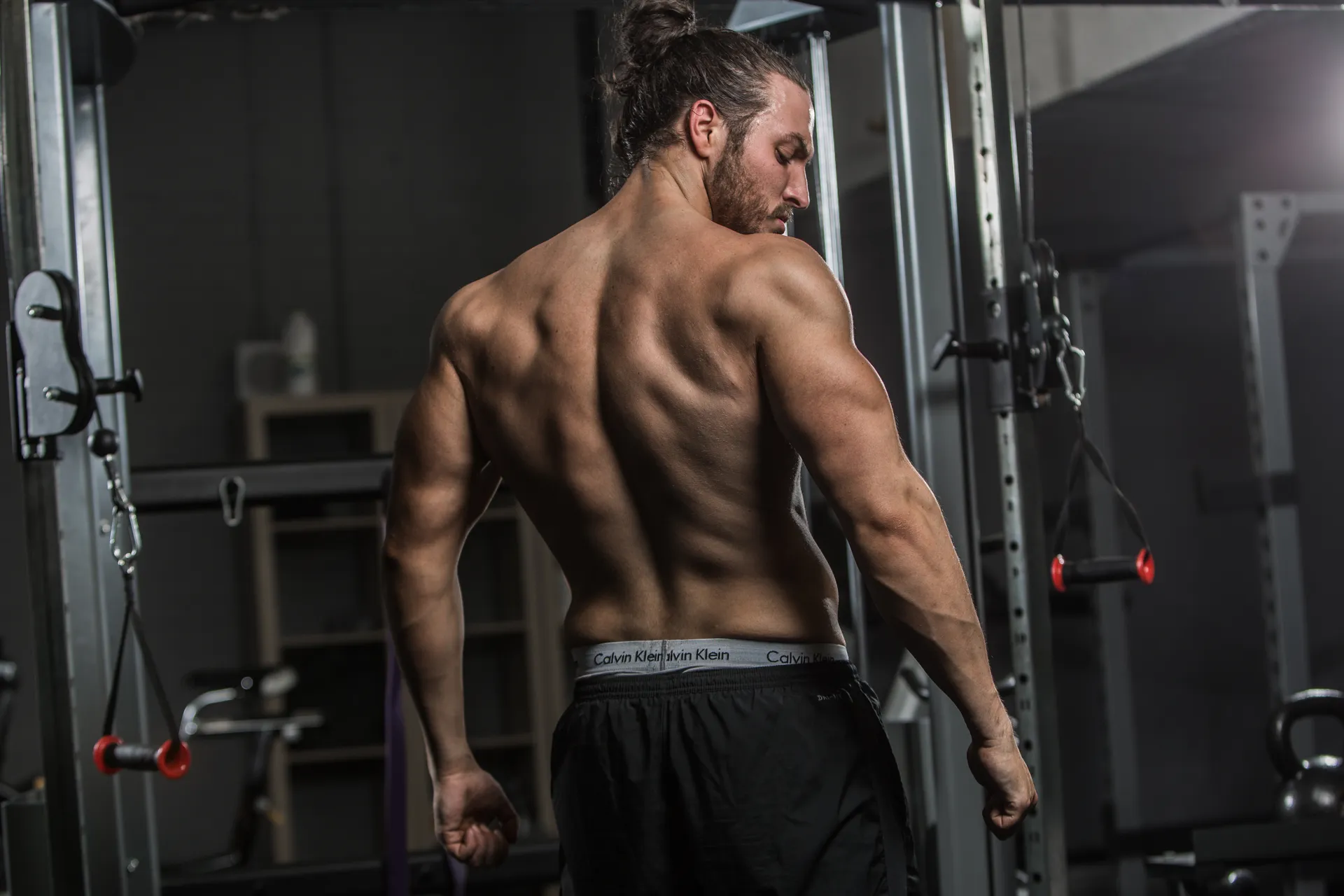 Trainer coaching a client through a strength exercise