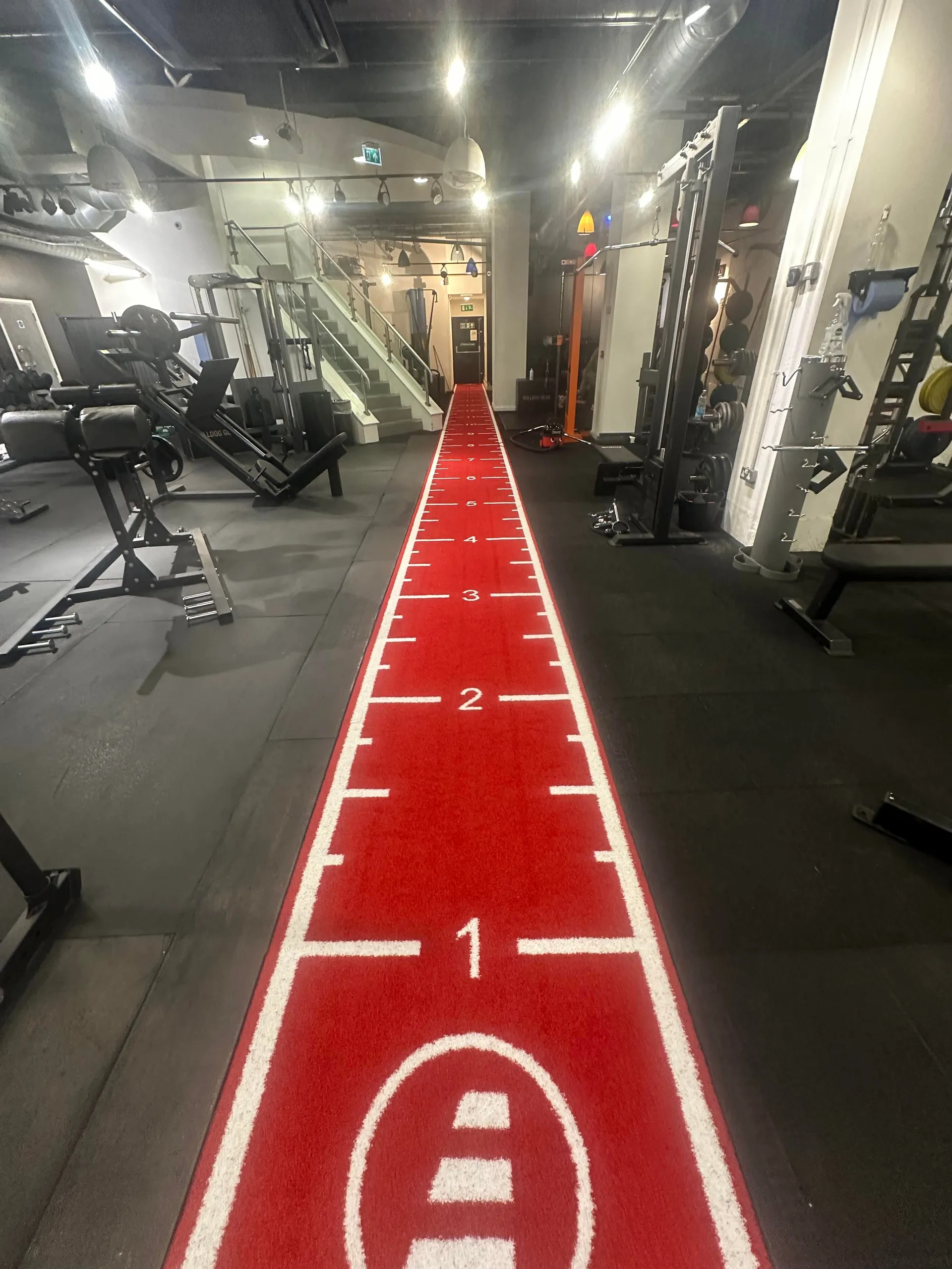 The red 20-metre sled track on the Evolve Fitness gym floor