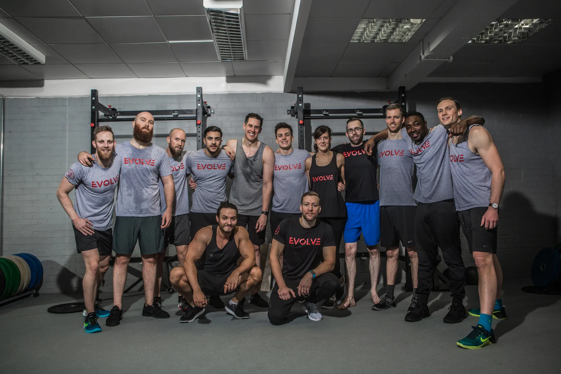 Evolve Fitness group standing together in the training facility